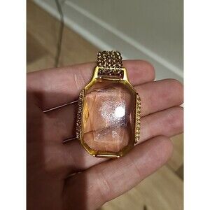 SWAROVSKI TOPAZ PENDANT WITH TOPAZ PARVEY CRYSTALS.